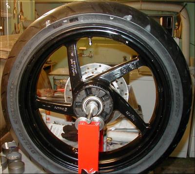 Push the tire into the drop center and pry opposite