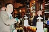 Member Nick (Secretary), buying drinks. Note the bar. The real ale, which members are drinking, is dispensed from the two taps just visible above Nick's raised wrist.