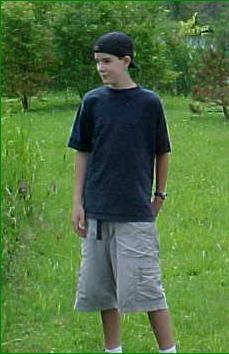 ian is wearing shorts and a t shirt