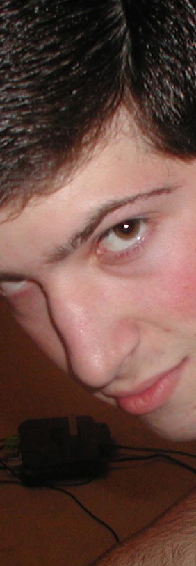 a sexy closeup of our man Eric Gold, known to the 'in' crowd simply as Goud. If there's ever inappropriate grinding going on at a party you can be sure that Goud isbehind it, especially if there's other guys involved. But we [platonically] love him anyway. Goud has a pretty pimpin' apartment in Jefferson Commons with Brian, Aaron and Chris (not me). His parents' house is also ridiculously nice, with a basement roughly the size of my entire neighborhood. His parents mus make a lot of money but I don't think I've ever actually seen either of them. Some say they're just figments of our imagination, and Goud actually made all that money strutting down on Troost on saturday nights. Come to think of it, that would certainly explain a lot. Click to see Goud with his apartment buddies Aaron (left) and Chris (right). Goud's the one on top, as always. Ha, ha. It never gets old!