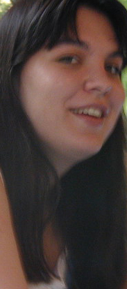 here is Jackie, who we ended up corrupting over the course of high school. I'm not sure how we accomplished this monumental task, but I'm sure it had something to do with Jon Akers continually humping every object within reach. Jackie goes to St. Louis University, whose initials SLU make you wonder if there really is an underlying synchronicity in the universe. Ha ha, no, Jackie is a realy nice girl. Seriously, you should take her out for dinner. She even plays the flute! Though she refuses to tell us any band camp stories. Hey, we tried. Other things Jackie likes: West Side Story, soap operas and, sadly, N'Sync. Don't worry, we're working on the N'Sync bit, hopefully we'll have her a Captain Beefheart fan before the end of college. Clicky for a pciture of me and Jackie that our parents really like.