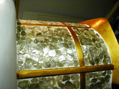 The window areas are being covered with native mica to reflect the sun.