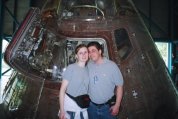 Standing by the nose of a rocket from the 60's