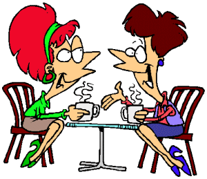 2 women talking at table