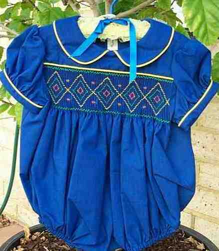Smocked dark blue rompers with yellow piping