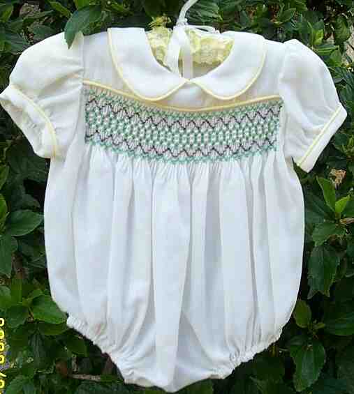 White, smocked, beaded rompers