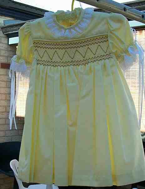 Ribbon trimmed smocked dress