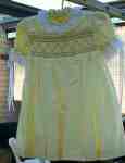 Smocked dress with lace and ribbons