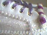 pearls, lace, wired ribbon for the laces and ribbon roses top off a perfect pair of shoes.