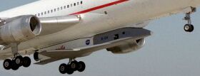 a L-1011 carrying the X-34 under its belly on a captive flight. CLICK HERE for the complete(558*488 56.7 KB) picture