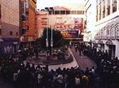 Camping out on the streets of Japan: People camped overnight to purchase tickets for the 
first Evangelion movie. Queues were up to 500 metres long