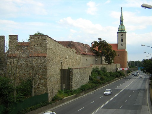 a stretch of the city walls, with the Cathedral in the background and Staromestska ulica in the foreground.