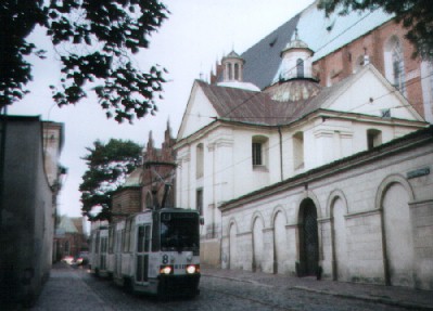 a tram running down Dominikanska