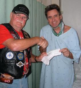 RED Ribbon Forces presents cheque to injured soldier Terry Hunter