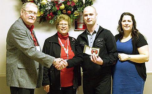 RED Ribbon Forces, Brian Goodfellow and Eleanor Bookman offer thanks at the Army, Navy, Air Force Club to SGT Luc Piquette and Melissa Piquette in the form of an Afghanistan Vet Belt buckle and RED Ribbon pin for his on going service and her support to our great country of Canada!