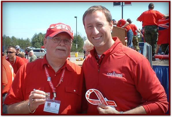 Minister of National Defence, Hon. Peter MacKay shows support with a Red Ribbon