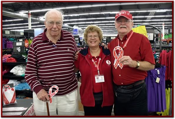 Sgt. Mark Benson dislpays red ribbon on two wheels