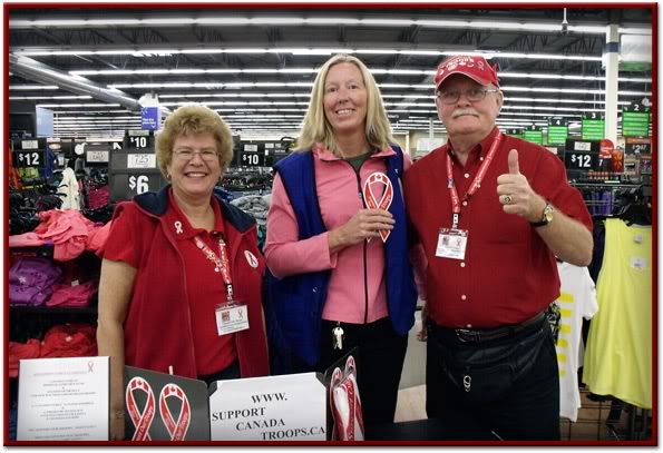 Sgt. Mark Benson dislpays red ribbon on two wheels