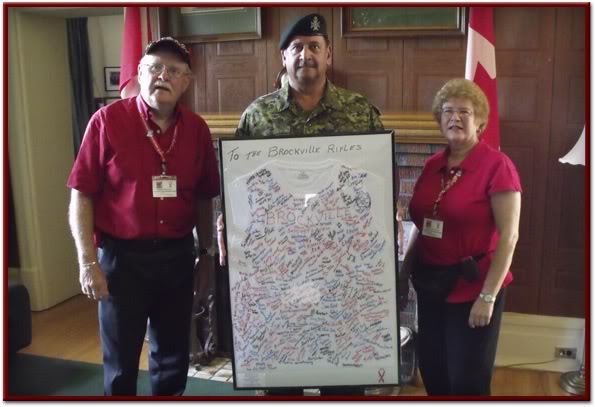 LCol. Jeffrey Shaver of the Brockville Rifles receiving signed and framed T-Shirt from many Brockville area proud Canadians!!