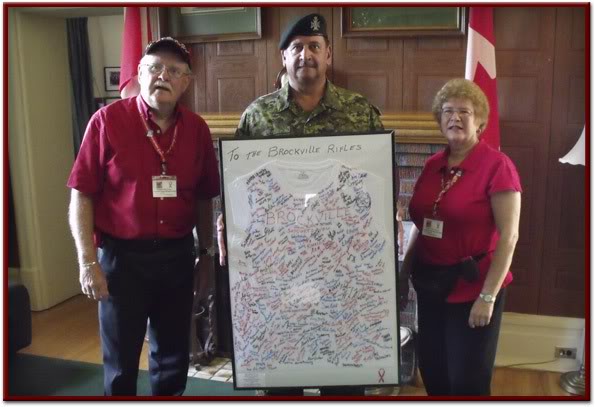 LCol. Jeffrey Shaver of the Brockville Rifles receiving signed and framed T-Shirt from many Brockville area proud Canadians!!