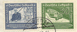 Count Ferdinand von Zeppelin surveys the terrain from his airship.  Click this stamp pair to view the envelope they are posted on.