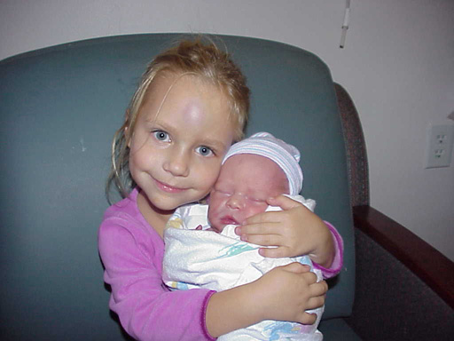 Madison showing off 'her baby' Mason