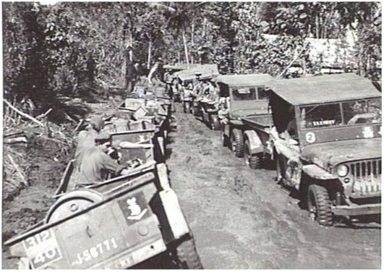 Jeeps showing the 3rd Div tac sign.