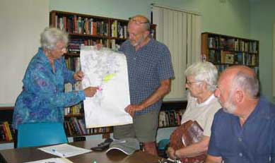 Members examining map of wetlands