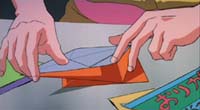 Sasami faz um origami de grou