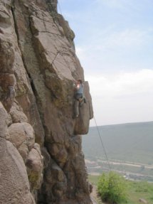 Allison climbing through the low crux on Dennis Spies the Line
