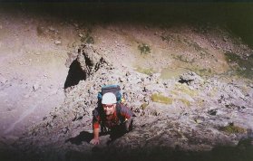 Bryan climbs up the first techinical pitch on Ellingwood, with big exposure below to camp and the lake