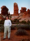 Jules with Owl Rock in background, Arches NM