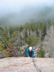 Marilyn climbs above the swirling fog at Parachute