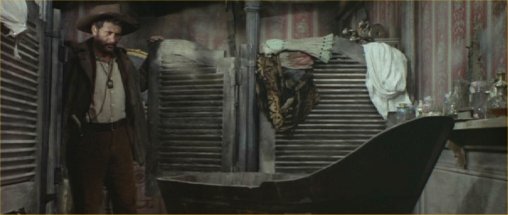 Image: In a wrecked building, Tuco finds a bathtub