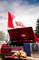 The flag, flying proudly above the car