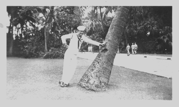 Ralph leaning on palm