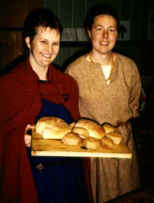 Denise and Christobel proudly displaying their results from the period bread making workshop, Rusalia 1998.