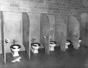 Military Men Using Communal Toilets