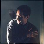 Una bala roza el brazo de Mulder