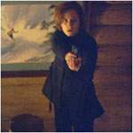 Scully pierde la visi�n cuando Peattie irrumpe en la casa segura