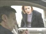 Scully encuentra al Fumador en su auto