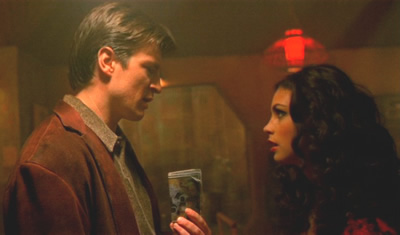 Mal giving Inara money
