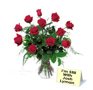 Roses and a card that says, "I'm still with Josh Lyman"