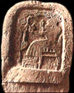 El, on a stone stela from Ugarit, seated on his throne, his feet on his footstool