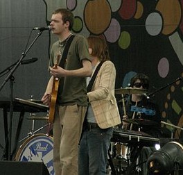 Tom does his best pose & gets obscured by a cymbal