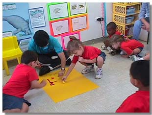 Pre-school students at Centro de Desarrollo Preescolar Playing Math Games