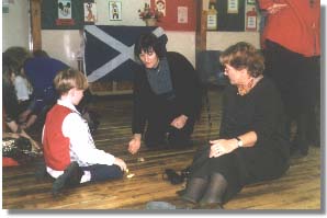 Patricia Spiller and her colleague Rosa Playing Traditional Games in Scotland, Photo by Petru Dumitru