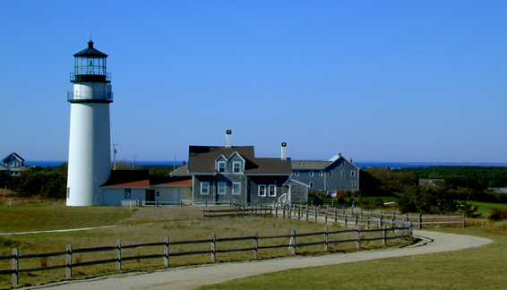 A lighthouse on Cape Cod with a foot path winding around in front