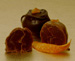 Our milk or dark chocolate-dipped hand-formed orange truffle.