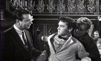 Danny (Elvis) is threatened by mob boss Maxie Fields (Walter Matthau) in the nightclub scene in King Creole.